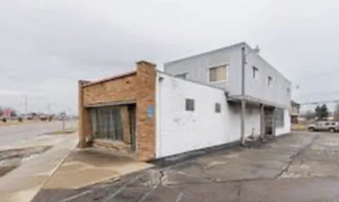 Commercial building with storefront and upper level